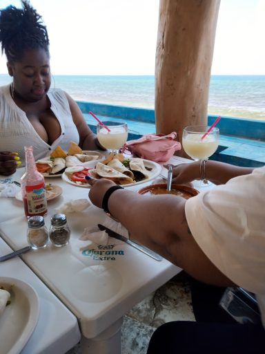Sharese and Katie enjoying tacos in Mexico
